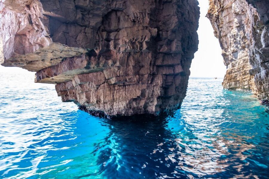 From Split: Luxury Cabin Boat Tour to The Blue Cave and Hvar - The Blue Cave: the duck-under moment you’ll remember