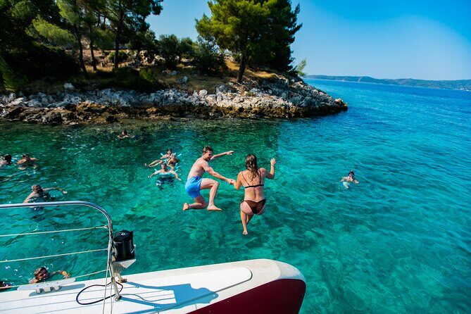 Full-Day Catamaran Cruise to Hvar & Pakleni Islands with Food and free Drinks - Deck Party by Sunset: The Fun Side of the Sailing