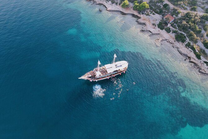 Out to Sea Split Boat Party w/ Blue Lagoon Swim, Dj & Afterparty - Bars, Welcome Shots, and What You’ll Pay For