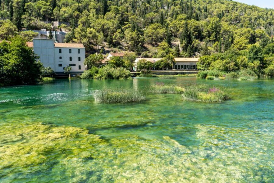 Split: Private Transfer to Krka with Driver & Optional Guide - Krka River boat cruise (30 minutes): a calm break in the middle